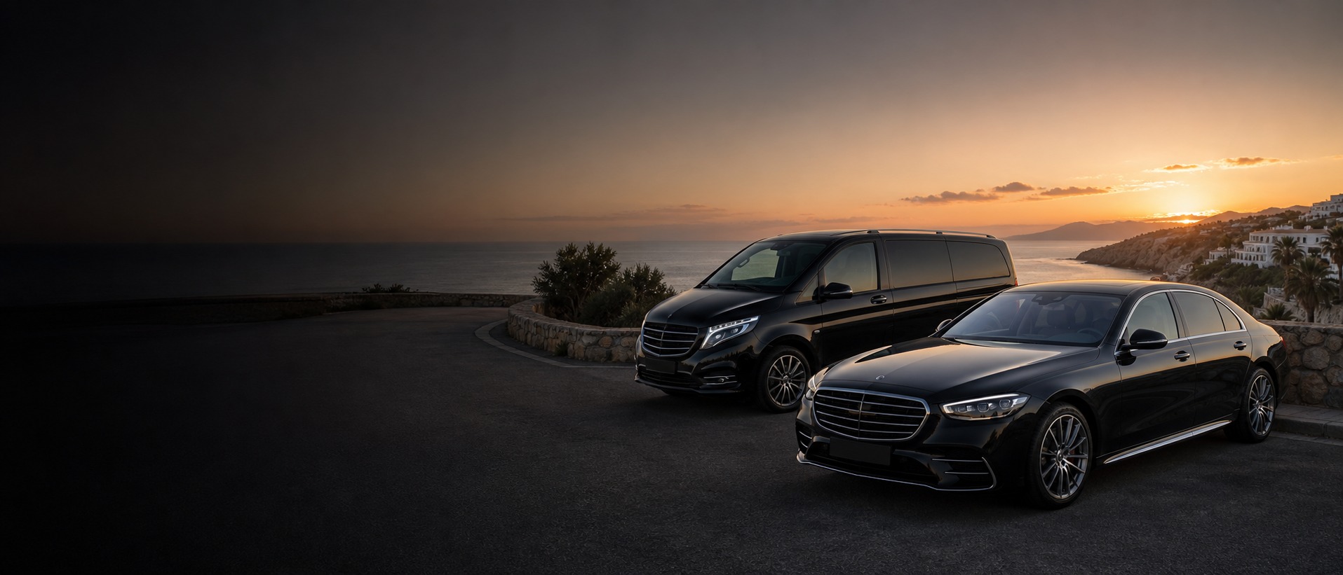 Black executive vehicles on an Andalusian coastal road at sunset
